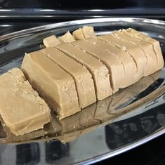 some kind of food that is sitting on a plate in front of a stove top