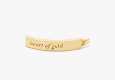 Our classic ID bracelet celebrates some of our favorites turns of phrase. This minimalist gold-tone one is engraved with some sweet words: heart of gold. (We mean yours by the way.) | Kate Spade Heart Of Gold Id Bracelet Gold Heart-shaped Name Bracelet For Everyday, Everyday Gold Heart Name Bracelet, Personalized Gold-tone Bracelets As A Gift, Elegant Yellow Gold Jewelry With Engraved Text, Adjustable Gold Name Bracelet With Heart Charm, Classic Gold Bracelets For Valentine's Day, Personalized Yellow Gold Heart Bracelet For Everyday, Everyday Personalized Yellow Gold Heart Bracelet, Gold Heart Bracelets With Name