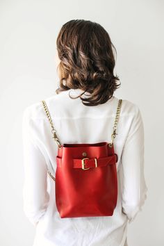 Leather Backpack Women, Bags for Women, Leather Shoulder Bag, Red Crossbody Bag with Chain, Evening Bag 💓Convertible bag, 3 in One ! Cross body/ Handbag/ Backpack Chain Edition🎀 * Simple, Elegant * High Quality, natural leather * Safe - Front buckle and button snap closing mechanism. * Interior pocket with zipper * Easily Convertible - Cross body, shoulder bag, backpack * No lining *Comes with Antique Brass Chain ⚠ Color of the bag may be a little different, it depends on a leather batch, whic Bucket Bag With Gold-tone Hardware For Gift, Gift Shoulder Bag With Gold-tone Hardware, Everyday Bucket Bag With Chain Strap Satchel, Red Shoulder Bag With Metal Hardware For Everyday, Everyday Red Shoulder Bag With Metal Hardware, Everyday Backpack With Chain Strap, Red Satchel With Metal Hardware For Everyday Use, Red Bags With Metal Hardware For Everyday Use, Red Satchel With Metal Hardware