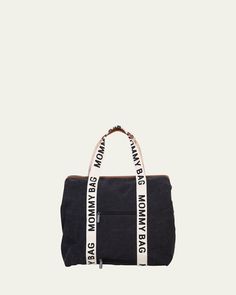 a black duffel bag with white lettering on the front and side straps that say,