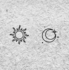 the sun and moon are drawn on paper