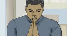 a man is praying with his hands together