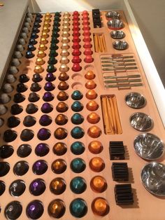 an assortment of buttons and spoons on a table