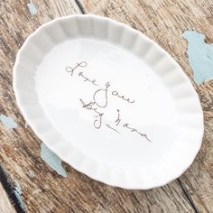 a white plate with writing on it that says thank you