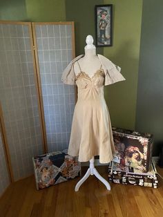 Very cool 1950’s beige formal dress with matching bolero. Both are made of a very heavy fabric. Weird, but the dress and jacket are not the same color, dress is a bit more yellow than jacket. Bolero does not have its buttons. Dress has a sizable water stain on the skirt as well as a couple smaller stains, and the bodice is pretty stained and discolored, likely from sweat?? Definitely needs some TLC, but is totally structurally sound and unique. Being sold as isWomen’s size smallDressBust: 35”Wai Beige Formal Dress, Same Color Dress, 1950s Formal Dress, Beige Formal Dresses, Vintage Gold Rings, Silk Wedding Dress, Dress And Jacket, Wedding Dresses Photos, Color Dress