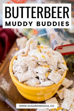 a yellow bowl filled with muddy buddies on top of a wooden table next to other items