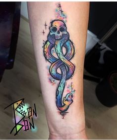 a tattoo on the leg of a person with a skull and an infinite sign in it