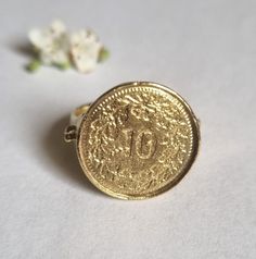 Signet ring women, gold coin ring, pinky ring, coin signet ring, coin pinky ring, coin pinky ring, silver coin ring, mens ring This lovely, silver coin ring was made of a Swiss Franc 10p coin, which was soldered to a wide handmade band decorated with silver granolites, creating a beautiful signet ring for women. The signet coin ring is available both in 14k gold plating over brass or silver and in solid sterling silver shiny or slightly oxidized (watch the short video to see). The ring is a grea Vintage Coin Signet Ring As Gift, Vintage Coin Signet Ring For Gift, Vintage Coin Shaped Signet Ring Gift, Elegant Engraved Coin Rings, Hallmarked Coin Shaped Signet Ring As Gift, Gold Coin-shaped Signet Ring For Gift, Gold Coin Shaped Signet Ring, Gold Coin Signet Ring For Gift, Gold Coin Shaped Signet Ring For Gift