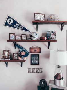 some shelves with football memorabilia and pictures on them