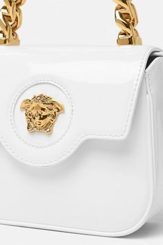 Versace la medusa mini bag in optic white. 100% Calf leather, Lining: 100% Nappa leather Length: 16cm x Width: 6cm x Height: 12cm Fits Iphone 15 Pro Max Made in IT Medusa Versace, Prada Outlet, Best Suitcases, Leather Mini Bag, Ankle Boots Dress, Bag With Chain, Bag Suitcase, Kids Sunglasses, Shoes Outlet