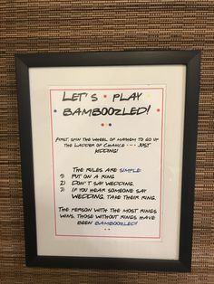 a sign on the wall that says let's play gamezoozled in front of it