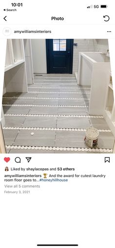 an instagramted photo of someone's bathroom with the door open and floor tiles laid out