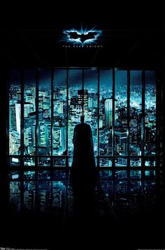 the dark knight rises movie poster with batman standing in front of cityscape at night