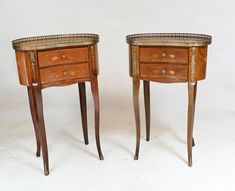 two small wooden tables with drawers on each side