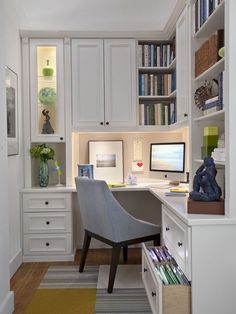 a home office with built in bookshelves and desk