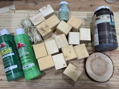 several different types of wood are laid out on a wooden table next to some glue