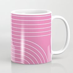 a pink coffee mug with white lines on it