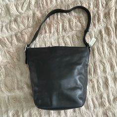 Vintage Coach Large Black Hobo Handbag From Early 2000’s. Strap Is 1.5 Inches Wide And Adjustable From 28 Inches To 30 Inches Using Grommets, Or Double To Shorten. Roomy, Supple, And Slouchy. Measures 14.5 Inches Across Top And 14.5 Inches Tall (As Shown In Photo Measurements). Bottom Measures 8.25 Inches By 6.25 Inches. One Interior Zip Pocket And Two Interior Slip Pockets. Easy Elegance, Carry All Of Your Essentials Plus Throw In Your Cardigan, Water Bottle, Ipad. Excellent Condition, Never Wo Coach Bucket Shoulder Bag For Travel, Coach Bucket Hobo Bag For Travel, Modern Coach Bucket Shoulder Bag, Coach Hobo Bag With Adjustable Strap For Travel, Coach Bucket Hobo Bag, Coach Rectangular Hobo Bag For Everyday Use, Coach Rectangular Hobo Bag For Travel, Coach Bucket Hobo Bag For Daily Use, Coach Leather Bucket Hobo Bag