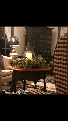 a living room filled with furniture and a candle