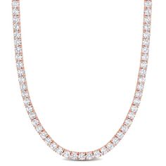 Dazzle with glory with this Created White Sapphire Tennis Necklace. Crafted in rose plated sterling silver, this shining necklace features 103 round-cut created white sapphire gemstones (4x4mm) in a tennis pattern for a regal look. This adjustable necklace measures 17-inches in length along with a 3-inch extension, secures with a lobster clasp and is perfect for layering with other necklaces. Enhanced with a high polished finish, this gift worthy necklace is a sparkling addition to any jewelry c Rose Gold Round Tennis Necklace As A Gift, Rose Gold Brilliant Cut Tennis Necklace For Anniversary, Anniversary Rose Gold Brilliant Cut Tennis Necklace, Rose Gold Tennis Necklace With Diamond Accents, Classic Rose Gold Tennis Necklace, Rose Gold Diamond Tennis Necklace With Accents, Rose Gold Tennis Necklace With Diamond Accents For Anniversary, Classic Rose Gold Round Tennis Necklace, Anniversary Rose Gold Tennis Necklace With Diamond Accents