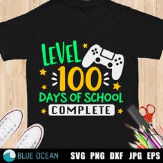 a t - shirt that says level 100 days of school complete with a video game controller