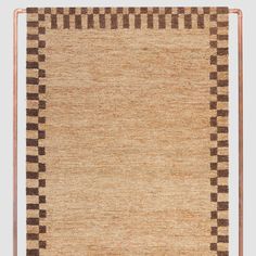 an area rug with brown and black squares on it