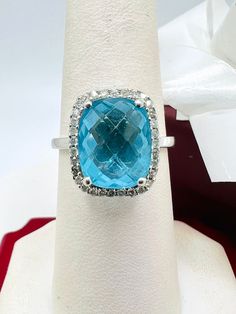 14K White Gold Blue Topaz & Diamond 0.35ct Ring Size 7.25 A perfect gift for your loved one for any special occasion or holiday! Total Ring Weight: 3.89g Ring Length: 28.26mm Ring Width: 20.18mm Gemstone: Diamond Total Diamond: 0.35ct Item will be placed into a gift box. * Fine Jewelry Blue Topaz Ring With Diamond Accents, Blue Topaz Ring With Halo Setting For Anniversary, Aquamarine Diamond Ring With Diamond Accents For Gift, Aquamarine Diamond Ring With Accents For Gift, Aquamarine Diamond Ring With Accents As Gift, Diamond Topaz Ring With Vs Clarity For Gift, Diamond Topaz Ring With Vs Clarity As A Gift, Topaz Ring With Diamond Accents As Gift, Blue Diamond Gemstones For Anniversary