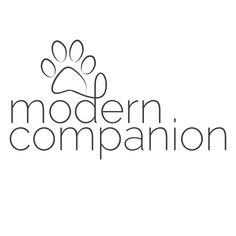 the modern companion logo with a dog's paw on it, in black and white