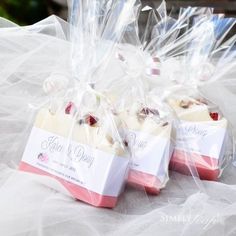 three pieces of cake wrapped in plastic sitting on a table