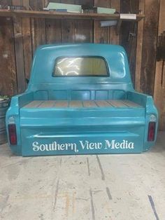 an old blue pickup truck with the word southern view media on it's bed