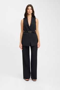 Own your workweek in style with our Win the Workweek Black Long Vest and Pants Set, designed for a bossy chic look The vest features a lapel-collared neckline, a sleeveless relaxed bodice, and a matching sash tie belt Includes twin functional welt pockets for a polished finish Pants feature a high, darted waist that flows into dramatic, wide pant legs with a hidden side zipper and clasp Available in black only Made from quality polyester fabric Comes in sizes XS-L Model is wearing size S Vest And Pants Set, Vest And Pants, Long Vest, Long Vests, Long Blazer, Work Week, Wide Pants, Romper Dress, Tie Belt