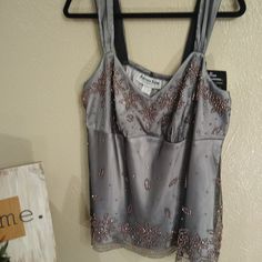 Another Thyme Created Another Stunner! This Vintage Cami/Tank Is 100% Polyester With No Give. Outside Is Beaded On What Feels Like A Layer Of Tulle (Black Or Dark Brown) Over A Very Light Grey Satin Shell. All Of The Beads Are A Bronze/Brown Color. Definitely A Hand Wash Item. The Beads Appear To Be Fragile And Glued On. Very Shiny. Bust Area Is Gathered At What Amounts To An Empire Waistline. Bottom Edge Has A Scalloped Finish With Beads Along The Entire Bottom. Purchased At Catherines Embellished Camisole Tops For Evening, Embellished Camisole Tank Top, Elegant Embellished Cami Tops, Elegant Embellished Sleeveless Camisole, Fitted Sleeveless Top With Beaded Straps, Sleeveless Beaded Straps Top For Night Out, Elegant Sleeveless Top With Beaded Straps, Elegant Sleeveless Tops With Beaded Straps, Elegant Beaded Tank Top For Spring