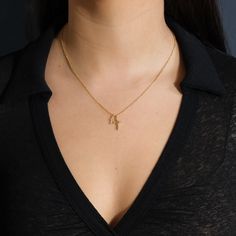 Two beautiful gold cross pendants hang from this delicate chain, giving it a little more flair than a traditional single cross necklace. It's an ideal gift for anyone who's about to celebrate a wedding, a confirmation or a First Communion. Made from high quality materials to last for years to come. Materials: 14K gold plated brass Features: Measures 16" with 2" extender, 10-14mm charms, Lead & Nickel free, lobster clasp Gold Plated Cross Necklace With Delicate Chain, Dainty Crucifix Necklace With Adjustable Chain, Elegant Charm Necklace With Cross Pendant And Delicate Chain, Dainty Crucifix Clavicle Chain Necklaces, Dainty Crucifix Cross Necklace With Delicate Chain, Dainty Crucifix Clavicle Chain Necklace, Elegant Cross Charm Necklace With Adjustable Chain, Gold Plated Delicate Chain Necklace With Cross Pendant, Dainty Charm Necklace With Clavicle Chain And Cross Pendant