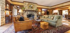 a living room filled with furniture and a fire place