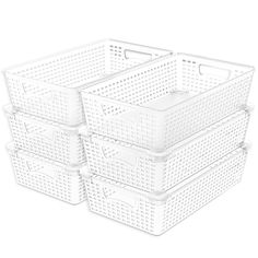 four white plastic storage baskets stacked on top of each other with holes in the bottom