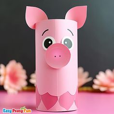 a pink paper roll with a pig face on it