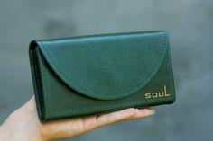 Comfortable leather wallet with magnetic button. The wallet has 2 sections for banknotes, 2 sections for cards and a pocket with a lock. Height: 3.5 inches (9 cm) Width: 7.1 inches (18 cm) Depth: 1.2 inches (3 cm) Thanks for visiting our store :-) Green Wallets With Card Slots For Gift, Green Wallets With Card Slots As A Gift, Elegant Green Bifold Wallet, Green Rectangular Wallet For Gift, Green Rectangular Wallet Gift, Elegant Green Wallets With Card Slots, Green Leather Wallet As Gift, Green Leather Wallet For Gift, Green Leather Wallets For Gifts