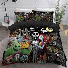 a bed covered in black and white comforter covers with cartoon characters on the cover