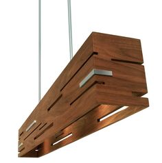 a wooden light fixture hanging from a ceiling