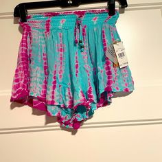 Hot Pink And Teal Tie Waist Juniors Small Shorts Runs Small But Stretches Will Fit Xxs Small Size 00 And 0 Casual Pink Bottoms For Festival, Bohemian Stretch Shorts For Spring, Stretch Beachwear Shorts For Spring, Trendy Blue Shorts For Festivals, Pink Bottoms With Elastic Waistband For Summer, Pink Bohemian Bottoms For Beach Season, Blue Bohemian Shorts For Spring, Bohemian Fitted Shorts For Summer, Bohemian Blue Shorts For Spring