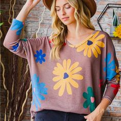 Colorful Floral Print Knit Oversized V-Neckline Top Trendy Oversized V-neck Sweater For Spring, Soft Knit V-neck Sweater For Spring, Oversized V-neck Sweater For Spring, Casual Oversized V-neck Sweater For Spring, Soft Knit V-neck Sweater For Day Out, Beige Long Sleeve V-neck Sweater For Spring, V-neck Soft Knit Sweater For Day Out, Trendy Brown Spring Sweater, Spring Soft Knit V-neck Sweater For Loungewear