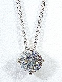 SOLID 14 kt white GOLD natural DIAMOND solitaire pendant with 18" necklace NATURAL round DIAMOND QUALITY : included COLOR: bright white .82 ct ( mm ) measures (mm) : 5.5 weigh (grams) : 1.5 marked :14 kt APPRAISAL VALUE $ 3600 sales tax collected by ebay all REASONABLE OFFERS will be considered ( items which are returned used , worn or not in the original condition received or if the security tags are removed or tampered will only receive a refund of 50 percent of the original sale price . Any missing stones must be reported within the first 24 hours with a picture . ) White Solitaire Necklace With Diamond Cut Round Pendant, White Solitaire Diamond Necklace In Platinum, White Platinum Solitaire Diamond Necklace, White Solitaire Pendant Necklace, Dazzling White Solitaire Round Pendant Necklace, White Solitaire Necklace With Round Stone, White Solitaire Necklace, Classic Round Gia Certified Diamond Necklace, Gia Certified Classic Round Diamond Necklace