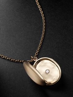 PATTARAPHAN's 'Neo Pritsana' necklace is strung with a locket that's intended to "keep your memories safe"; making it a thoughtful gift for a loved one or yourself. It's cast from polished 14-karat gold and opens to a single tiny diamond nestled at the centre. Engrave an initial or message on the front to further its sentimental appeal. Traditional Yellow Gold Jewelry For Keepsake, Traditional Yellow Gold Keepsake Jewelry, Luxury Keepsake Medallion Necklace, Luxury Medallion Locket Necklace, Luxury Ceremonial Medallion Necklaces, Luxury Locket Necklace, Amulet Style Medallion Locket Necklace With Detachable Pendant, Luxury Polished Pendant Locket Necklace, Yellow Gold Medallion Locket Necklace With Detachable Pendant