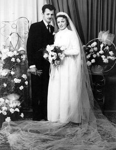 an old black and white photo of a bride and groom