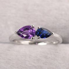 ◆ The ring is handcrafted from sterling silver and decorated with a dazzling 7*5 mm natural amethyst and 6*4 mm lab sapphire. It is suitable for engagement/anniversary/daily occasion. ◆ Production Description: Main stone Type: Natural amethyst and Lab sapphire Main Stone Shape: Pear Cut Main Stone Size: 7x5 mm(0.74 ct) and 6x4 mm(0.55 ct) Side stone: None Metal: 925 Sterling silver - Other options available in the drop down menu ◆ Customization: √Free for Add Engraving √Other Metal Type Availabl Amethyst And Blue Sapphire Ring, Sapphire Amethyst Ring, Sapphire And Amethyst Ring, Amethyst And Sapphire Ring, Purple Sterling Silver Rings For Anniversary, Purple Sterling Silver Anniversary Rings, Purple Sapphire Birthstone Ring For Promise, Purple Sapphire Gemstone Rings, Purple Solitaire Sapphire Ring For Anniversary