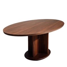 a round wooden table with an oval base