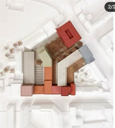 an aerial view of a building with many different colored blocks on the floor and walls