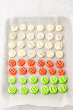 the cookies are decorated with green and orange icing