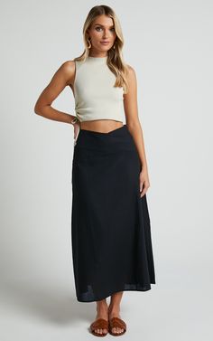 Get ready to turn heads in this flirty and playful Sundry Midi Skirt! With its linen look fabric and high-waisted design, this A-line skirt is perfect for casual days out or dressed up for a night on the town. The cross-front detail adds a touch of sassiness to your outfit, while the black color ensures versatility. Whether you pair it with a crop top or a cozy sweater, this midi skirt is sure to become your new go-to piece for effortless style. So why wait? Embrace your inner fashionista and st Aline Skirt Outfit, Tunic Tops Outfit, Black Linen Skirt, Tops Outfit, Skirt Outfit Summer, Aline Skirt, Black Midi Skirt, Black Midi, Linen Skirt