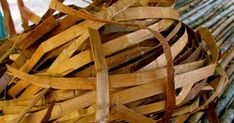 a pile of wood sitting on top of a wooden bench